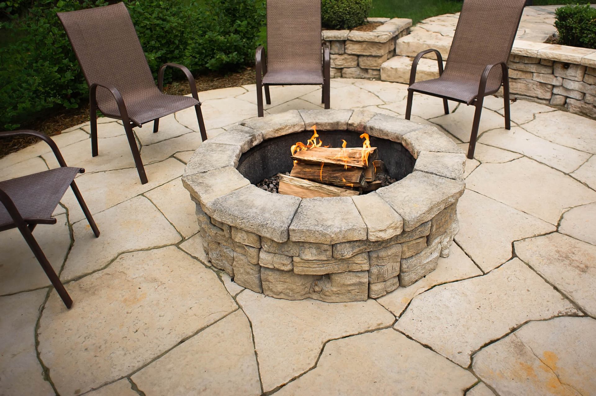 Natural Stone Fire Pit with Flagstone Patio - Professional masonry work in undefined
